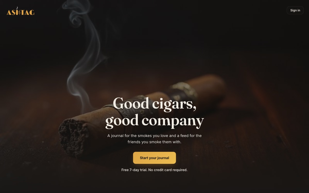 AshTag homepage: a lit cigar on dark wood, "Good cigars, good company"